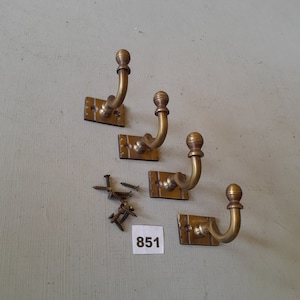 4 vintage style heavy cast brass Victorian design  coat hooks  in a AGED finish NOT lacquered or coated includes matching solid brass screws