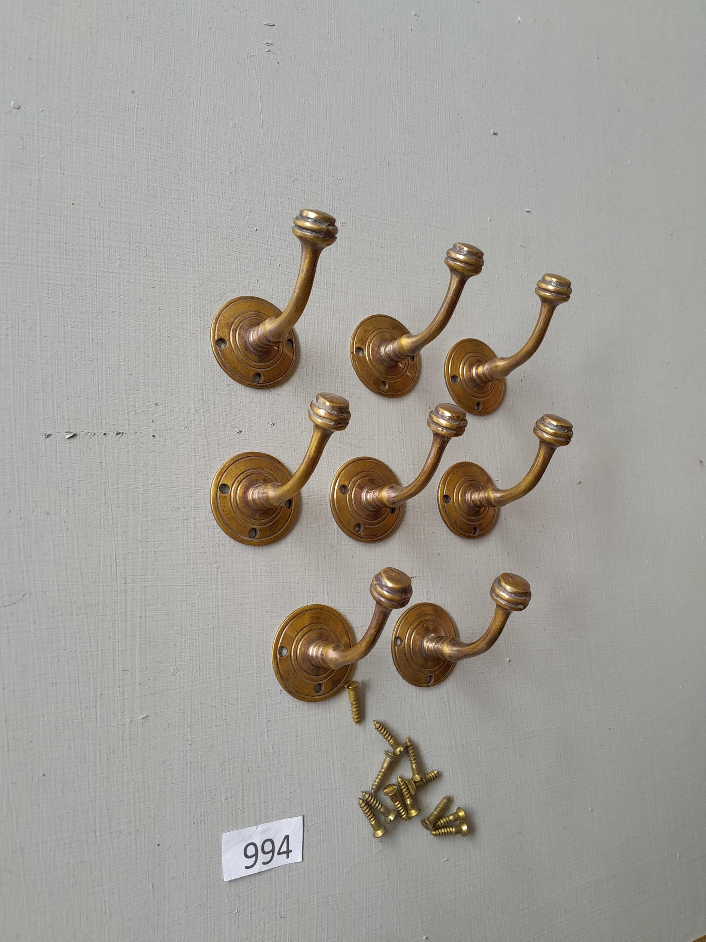 8 vintage style heavy cast brass Victorian design  coat hooks  in a AGED finish NOT lacquered or coated includes matching solid brass screws