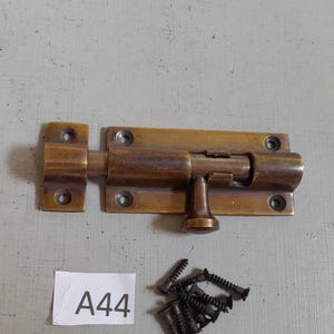 Vintage style chunky heavy duty cast brass door bolt or latch  bathroom door lock in an AGED finish includes matching aged brass screws
