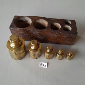 A fabulous Early Vintage brass weights set with date stamps with original teak  box