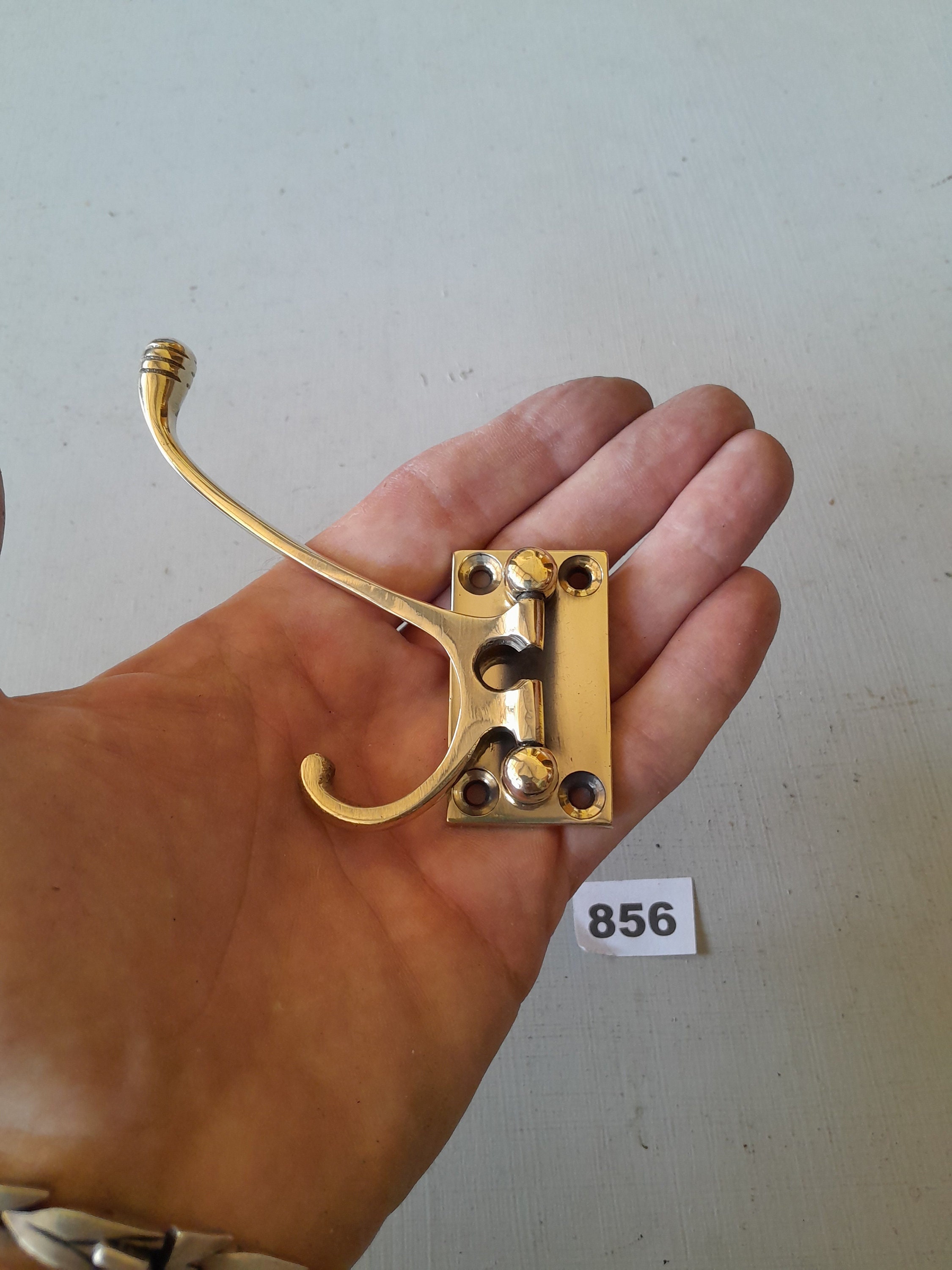 1 very practical vintage style heavy cast brass folding coat hook NOT lacquered or coated includes FREE solid brass screws