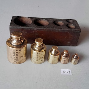 Early Vintage brass weights set with lots of date stamps with original teak  box
