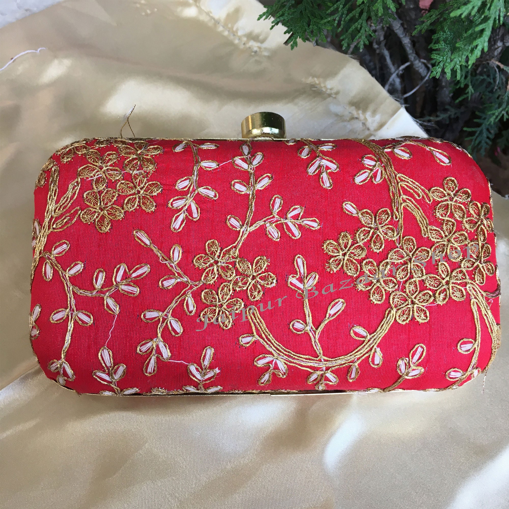 Just the right size. Bag in red color. Hand bag designed with rhinestones.  Clutch bag in female hands. Mini bag. Fashion handbag. Fashion accessory.  Vintage or retro clutch design. Classic purse -