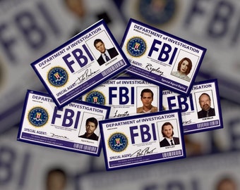 May include: A stack of six blue and white FBI identification cards with photos of different people. Each card has the text "DEPARTMENT of INVESTIGATION" and "FBI" in bold white letters.