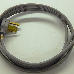 May include: A gray electrical power cord with a three-prong plug and two bare wire ends. The cord is coiled and has a gray rubberized coating. The plug has gold-colored prongs.