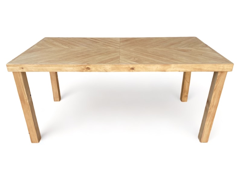May include: A rectangular wooden dining table with a light brown finish. The tabletop features a chevron pattern, and the legs are angled for stability. The table is approximately 72 inches long and 36 inches wide.