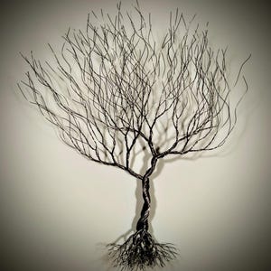 May include: A black wire sculpture of a tree with a twisted trunk and intricate branches. The tree is set against a white background.