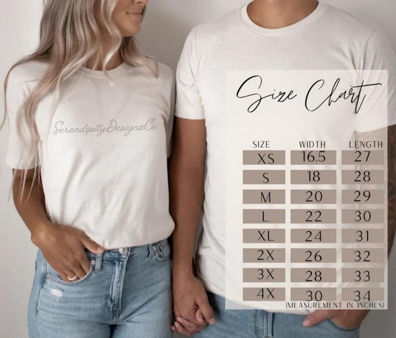 May include: A white short-sleeved t-shirt with the text SerendipityDesignzCo printed on the chest. Next to the shirt is a size chart displaying measurements in inches for sizes XS through 4X, listing width and length for each size category.