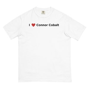 May include: White t-shirt with a red heart and the text "I ♥ Connor Cobalt" printed on the front.