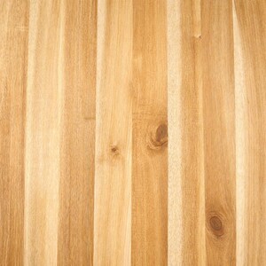 May include: A light brown wooden surface featuring vertical planks joined together. The wood grain displays natural variations in colour, ranging from pale cream to warm tan, with visible knots and linear patterns running throughout the texture.