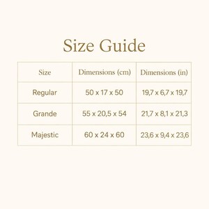May include: A Size Guide chart with brown text on a light background. It lists three sizes: Regular (50 x 17 x 50 cm or 19.7 x 6.7 x 19.7 inches), Grande (55 x 20.5 x 54 cm or 21.7 x 8.1 x 21.3 inches), and Majestic (60 x 24 x 60 cm or 23.6 x 9.4 x 23.6 inches).