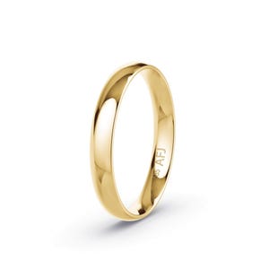 May include: A polished yellow gold band ring with a smooth, rounded profile. The interior of the band features a clear engraving that reads 585 AFJ, indicating the gold purity and a maker's mark on this simple, solid metal circular jewelry piece.