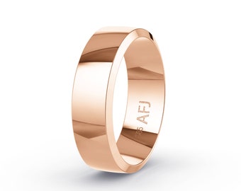 May include: A rose gold ring with a flat, beveled design. The ring has a smooth, polished surface and is engraved with "585 AFJ" on the inside. The ring is a simple, elegant piece of jewelry.