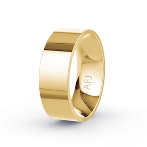 May include: A polished gold ring with a flat, wide band. The ring has a smooth, reflective surface and a minimalist design. The inside of the ring is engraved with "925 AFJ".