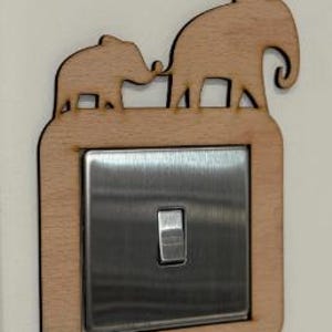 May include: A rustic wooden sign with the text "Welcome to our porch" in white lettering. The sign features a distressed finish and a simple, inviting design, perfect for outdoor decor.