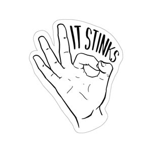 May include: A black and white illustration of a hand making the OK sign with the text "IT STINKS" written above the hand.
