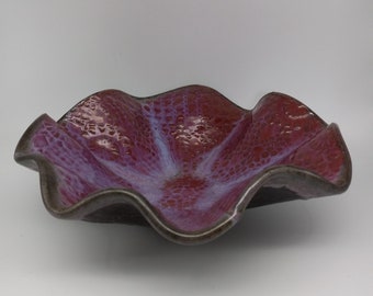 Pink/Purple Glazed Pottery Bowl w/Floral type Motif