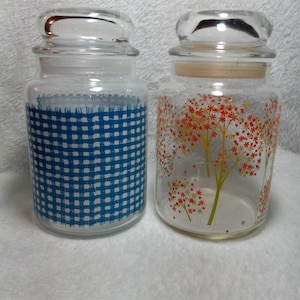 Set of 2  Glass Canister Jars 1 floral 1 blue plaid