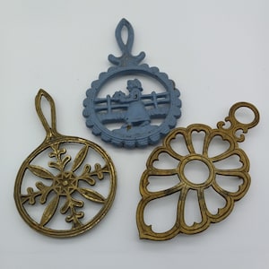 Set of 3 Trivets, 2 brass and one cast iron