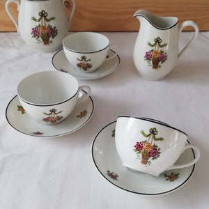 Antique Limoges porcelain teacup set with ribbon and flower basket