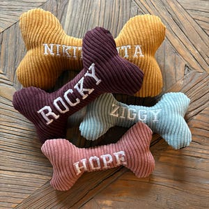 Embroidered bone dog toy with squeaker, various sizes, several colors