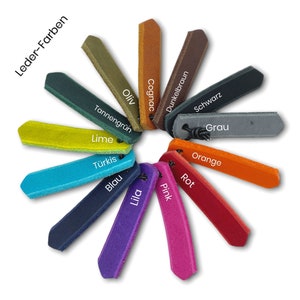 May include: Leather color chart with 14 different colors, including cognac, lime, turquoise, blue, pink, and red. The chart is labeled "Leder-Farben" in German.
