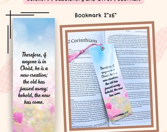 May include: A bookmark with the text "Therefore, if anyone is in Christ, he is a new creation; the old has passed away; behold, the new has come." The bookmark is 2" x 6" and features a floral design and the Bible verse 2 Corinthians 5:17.