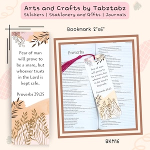 May include: A bookmark with the text "Fear of man will prove to be a snare, but whoever trusts in the Lord is kept safe. Proverbs 29:25." The bookmark is 2"x6" and features botanical illustrations and a tassel.