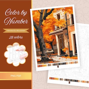 May include: Color by Number kit for adults. The image shows a fall scene with a cafe, trees, and falling leaves. The kit includes 28 colors and is available as a PNG PDF.