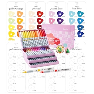 May include: A pink, multi-tiered box set of Arrtx acrylic markers, with a variety of colors including yellow, orange, pink, red, purple, and blue. The set includes color swatches and two individual markers.