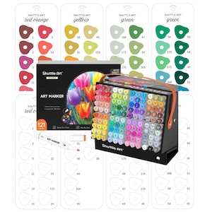 May include: A black art marker set with 121 markers, displayed in a black carrying case. The set includes a variety of colors, with color swatches and the brand name "Shuttle Art" visible. The box features a floral design.