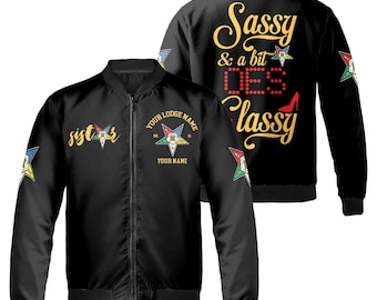 May include: Black bomber jacket with a gold embroidered design on the front and back. The front design says "sister" and the back design says "Sassy & a bit Dee Classy".