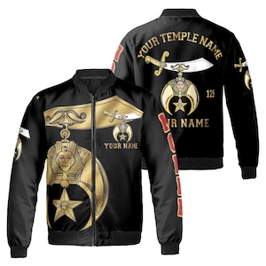 May include: Black bomber jacket with a gold Masonic symbol on the front and the text "YOUR TEMPLE NAME" and "YOUR NAME" on the back. The symbol features a crescent moon, a five-pointed star, and a sword.