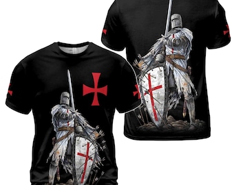 May include: Black t-shirt with a white knight in armor holding a sword and shield. The knight is wearing a white robe and a red cross is on his shield. The t-shirt has a red cross on the left side of the chest.