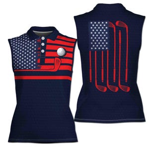 May include: A sleeveless golf shirt featuring a red, white and blue American flag design. The shirt has a navy blue background and includes golf clubs and a golf ball.