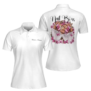 May include: White polo shirt with the text "Nail Boss" on the back. The design features a pair of hands with pink nail polish and butterflies. The front of the shirt has a space for a name.