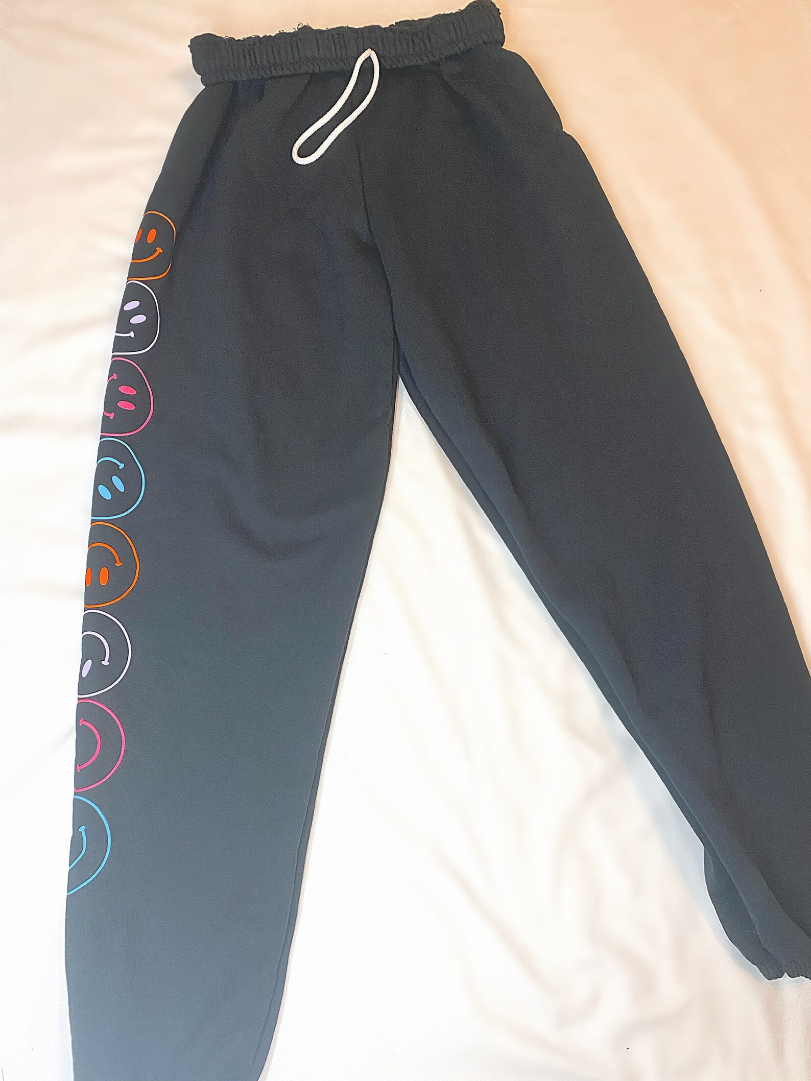 sweatpants with smiley face