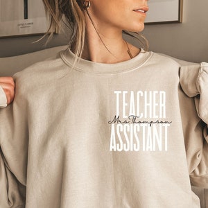 Personalized Teacher assistant pocket shirt, sweatshirt, hoodie, long sleeve, gift, custom name Teaching assistant, educational assistant