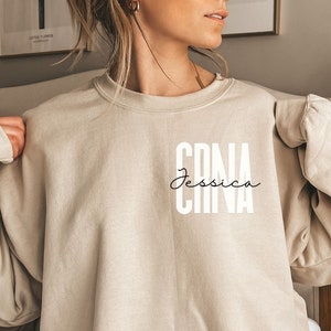 Personalized CRNA shirt, sweatshirt, hoodie, long sleeve, gift, pocket custom name certified registered nurse anesthetist, anesthesia