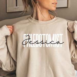 Personalized phlebotomist shirt, sweatshirt, hoodie, long sleeve, gift, custom name phlebotomy, matching shirts for Phlebotomist squad, sand
