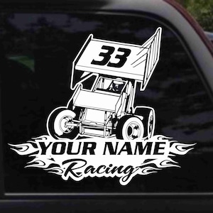May include: Black and white silhouette of a race car with the number 33 on the side. The car is surrounded by flames and the text "YOUR NAME Racing".