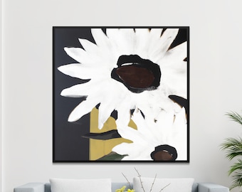 May include: A black framed canvas print featuring a white abstract floral design with brown centers. The flowers are painted on a black background with a gold accent.