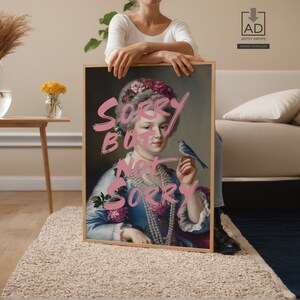 a woman holding a sign with a picture of a woman holding a bird