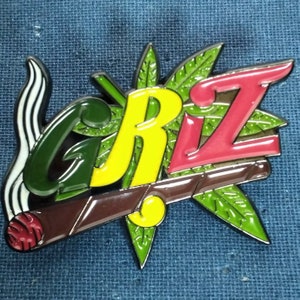 EDM Dj GRiZ Rasta Riddim enamel pin 1.75 inch by 1.25 inch