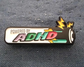 Powered By ADHD Battery/MentalHealth Awareness enamel pin (1.25 inch by 0.5 inch)