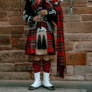 Scottish man in kilt playing bagpipes downloadable wall art