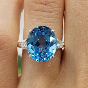 12x10mm Oval Swiss Blue Topaz, Natural Three Stone Gemstone Ring, Moissanite Accents, Sterling Silver, Made to Order