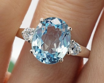 9x7mm - 14x10mm Oval Cut, Light Sky Blue Topaz, Three Stone Gemstone Ring, 6A Quality Cubic Zirconia Accents, Sterling Silver, Made to Order