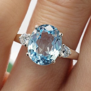 9x7mm - 14x10mm Oval Cut, Light Sky Blue Topaz, Three Stone Gemstone Ring, 6A Quality Cubic Zirconia Accents, Sterling Silver, Made to Order