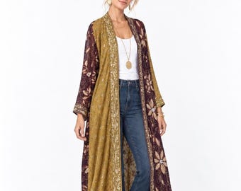 May include: A long, open-front duster kimono featuring a color-blocked design with mustard yellow and deep burgundy panels. The garment is adorned with intricate floral embroidery, metallic gold thread detailing, and a decorative border along the front.